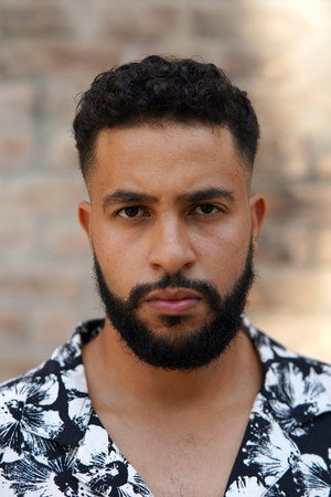 Issam Knouniz in Dinosaurs